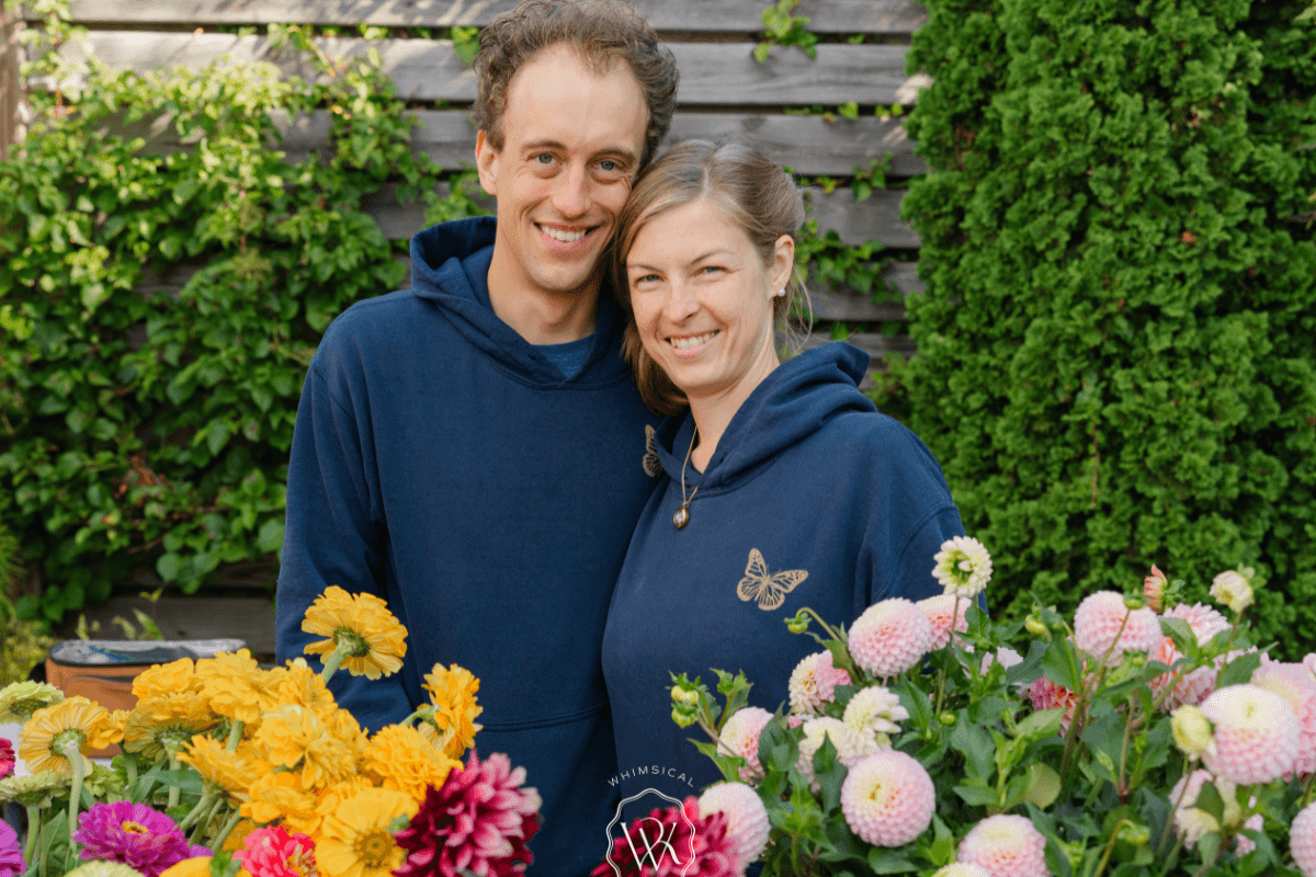 owners surrounded by greenery and flowers